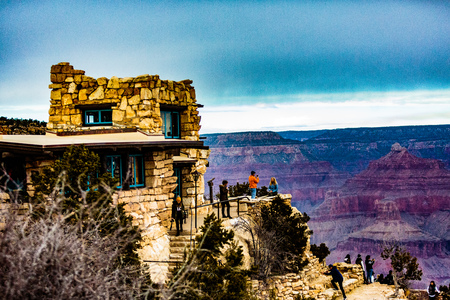 Grand Canyon NP, Arizona, USA - December 21, 2016:  Panorama of the Grand Canyon and the Lookout Studio as seen from the south rim, near the El Tovar Hotel in the Grand Canyon Village along the Rim Trail.の写真素材