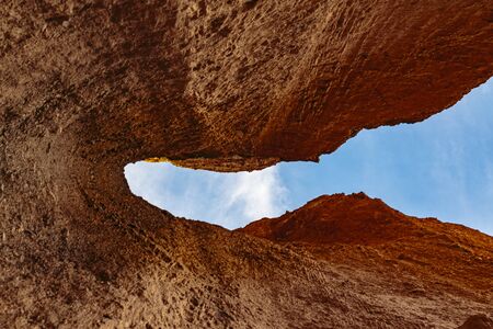 Death Valley, California, USA - December 17, 2018:  Red rock formatioins in a narrow river canyon form a cool Natural Bridge hiking attraction in Death Valley National Park.のeditorial素材