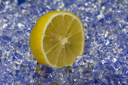 cold fresh lemon with ice in the backの写真素材