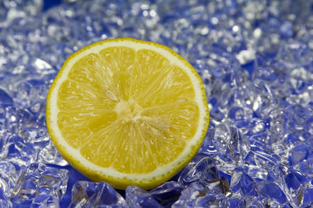 cold fresh lemon with ice in the backの写真素材