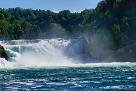 the famous rhine falls in the swiss near the city of Schaffhausen - sunny day and blue sky