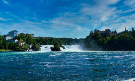 the famous rhine falls in the swiss near the city of Schaffhausen - sunny day and blue skyの写真素材