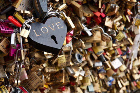 Love locks on The Bridge of Arts (The Bridge of Kisses) in Parisの写真素材
