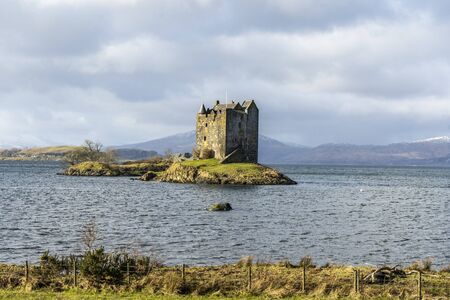 Old stone castle on the island in the middle of the lake