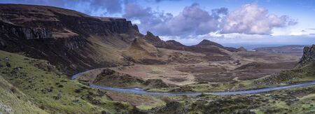 Road in the middle of beautiful rocky mountains panorama