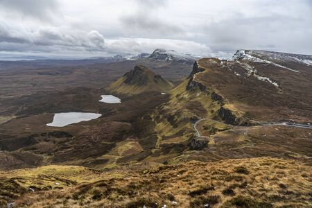 Road and two lakes in the middle mountains and large meadowsの写真素材