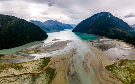 Delta of glacial river in a mountains aerial viewの写真素材