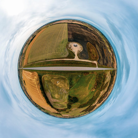 Tinny planet panorama of a never-ending road in a flat countryの写真素材
