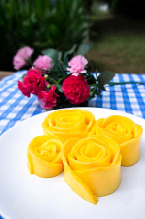 flowers made of mango slices on a tableの写真素材