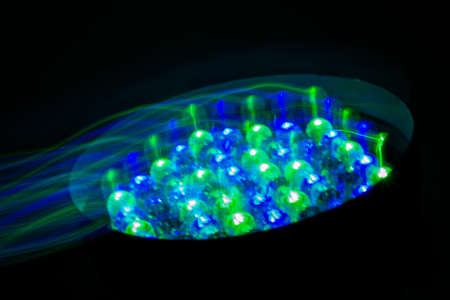 Color stage light isolated on black. Shot. Sceniq equpment closeup image with colourful lamps.