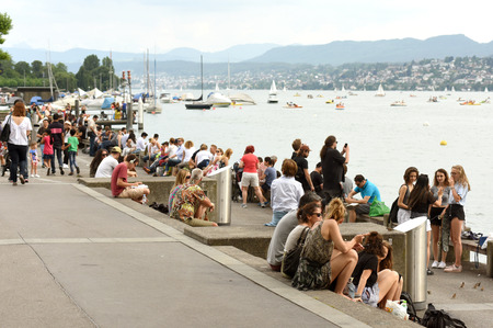 Zurich, Switzerland - June 03, 2017: People on quay Lake Zurich. Daily life in Zurich.のeditorial素材