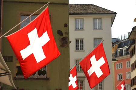 Swiss Flags on the facade building in Zurich, Switzerlandの写真素材