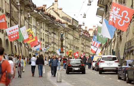 Bern, Switzerland - June 04, 2017: People in old city center of Bern. Shopping street in the old...