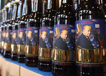 Lviv, Ukraine - May 20, 2017: A bottles of beer featuring US President Donald Trump  called "Trump" and written "President of Devided States of America"
brewed in "Pravda" beer restaurant in Lviv.のeditorial素材