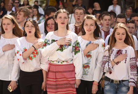 LVIV, UKRAINE - MAY 18, 2017: People wearing Vyshyvanka,(traditional Ukrainian embroidered blouses), sing the National anthem during world celebration Vyshyvanka Day in Lviv, Ukraine.のeditorial素材