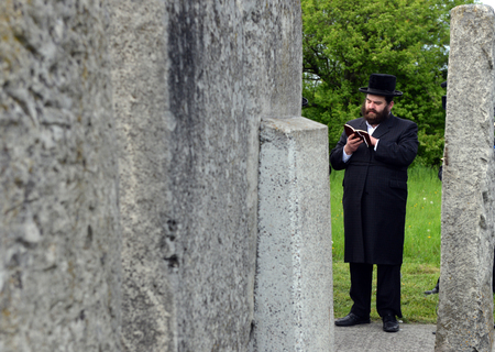 Belz, Ukraine - May 11, 2015: Ultra-orthodox Jews prayed on tombs of Tazdikim in Belz town, Lviv region.
