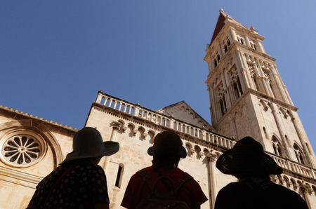 People look at the St. Sebastian church at St. John Paul II square in Trogir, Croatia. の写真素材