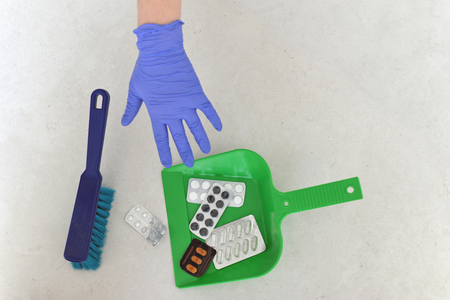  Health concept. pills in a scoop for garbagea. throwing pills awayの写真素材