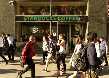 New York, USA - May 30, 2018: People on street near Starbucks Coffee in Midtown of Manhattan.のeditorial素材