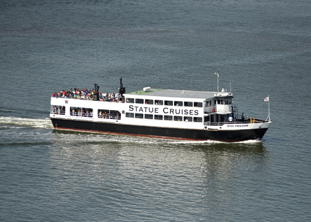 New York, USA - June 09, 2018: Ferry of Statue Cruises goes to the Statue of Liberty and  Ellis...