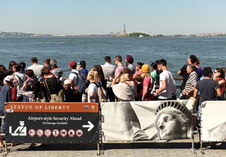 New York, USA - May 24, 2018: People waiting for the ferry of Statue Cruises in order to Visit the Statue of Liberty and  Ellis Island.のeditorial素材