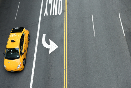 New York, USA - May 26, 2018: Top view on the yellow taxi on  street of Manhattan in New York City.のeditorial素材
