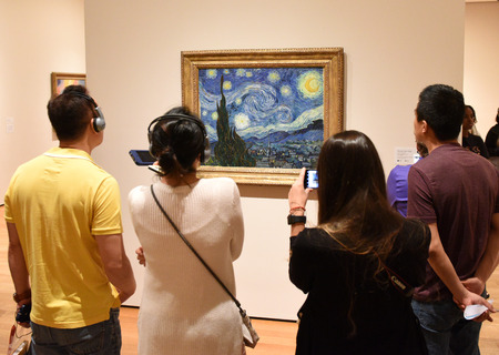 New York, USA - June 8, 2018: People near the Starry Night by Vincent van Gogh painting in Museum of Modern Art in New York City.のeditorial素材