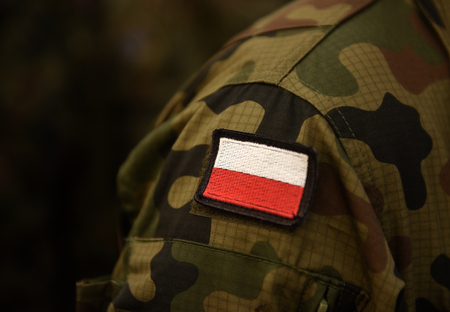 Polish patch flag on soldiers arm. Poland military uniform. Poland troops