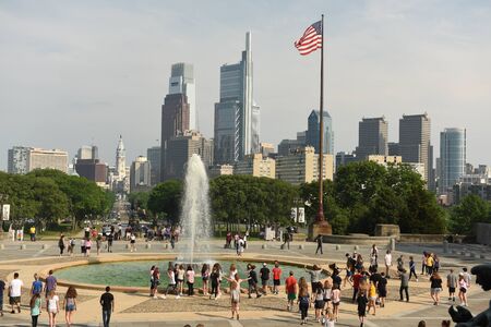 Philadelphia, USA - May 29, 2018: People around the Fountain near Philadelphia Museum of Art and Philadelphia view at the background.のeditorial素材