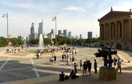 Philadelphia, USA - May 29, 2018: People around the Fountain near Philadelphia Museum of Art and Philadelphia view at the background.のeditorial素材