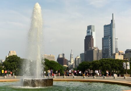 Philadelphia, USA - May 29, 2018: People around the Fountain near Philadelphia Museum of Art and Philadelphia view at the background.のeditorial素材