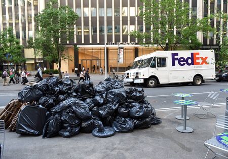 New York, USA - May 24, 2018: The cars of FedEx on the street of New York.