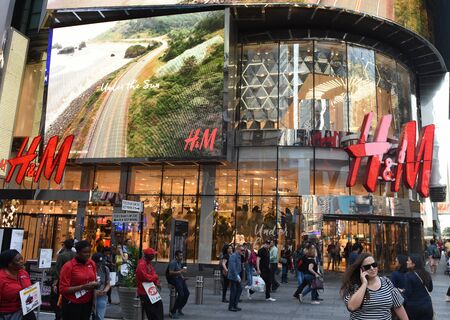 New York, USA - May 24, 2018: People near the H&M store in New York.