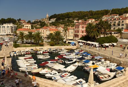 Hvar, Croatia - August 2018: Boats in Hvar old town on island of Hvar, Croatia