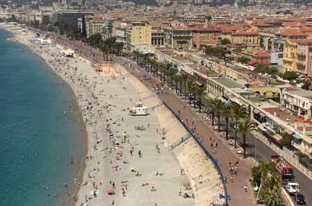 Nice, France - June 19, 2019: View of the beach and promenade of Nice.のeditorial素材