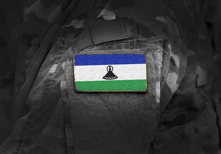 Flag of Lesotho on military uniform. Army, troops, soldiers. Collage.の写真素材