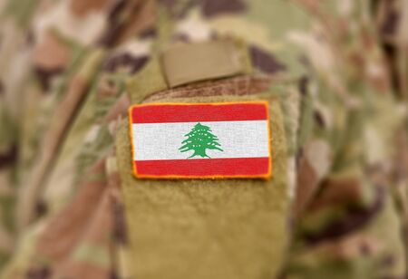 Flag of Lebanon on military uniform (collage).の写真素材