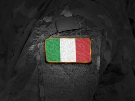 Flag of Italy on military uniform. Army, troops, soldier (collage).の写真素材