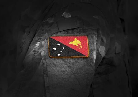 Flag of Papua New Guinea on military uniform. Army, armed forces, soldiers. Collage.