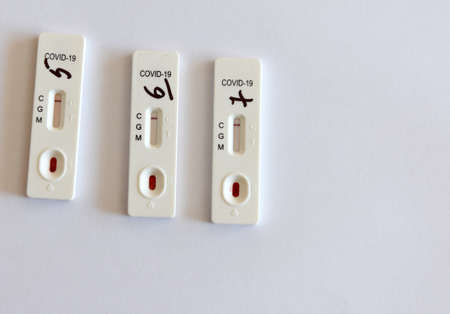 Lviv, Ukraine - March 31, 2020: Rapid tests for coronavirus COVID-19 on the table during testing of employees of local municipal institutions in Lviv.のeditorial素材