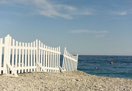 white fence on the beach by the sea on the beach, sea viewの写真素材