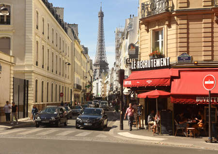 Paris, France - August 30, 2019: A people on street of Paris with Eiffel Tower on the background.のeditorial素材