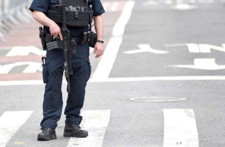 NEW YORK, USA - June 10, 2018: The New York City Police Department (NYPD) police officers performing his duties on the streets of Manhattan.のeditorial素材