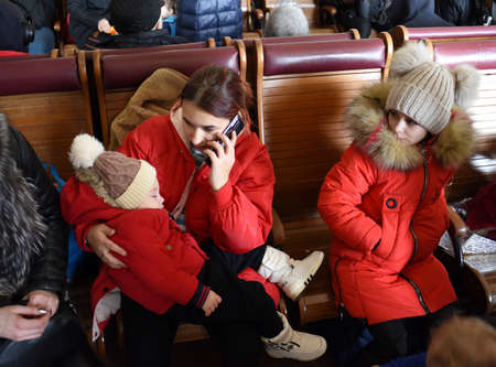 Lviv, Ukraine - March 1, 2022. Evacuees from eastern Ukraine in the railway station in western...