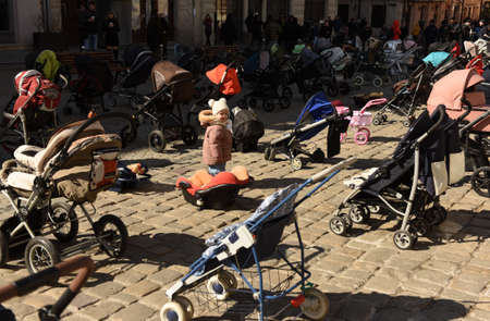Lviv, Ukraine - March 18, 2022: 109 empty strollers are seen placed outside the Lviv city council...