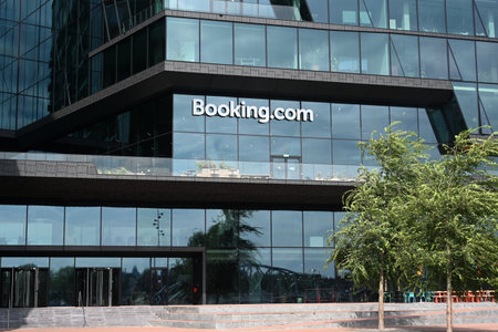 Amsterdam, Netherlands - August 24, 2024: The Booking.com HQ in Amsterdam. Booking.com is one of the largest online travel agencies.のeditorial素材