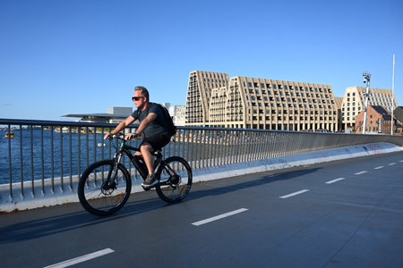 Copenhagen, Denmark - July 31, 2024: A cyclists on the street of Copenhagen.のeditorial素材