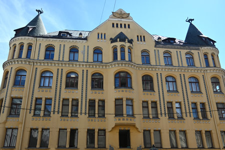 Cat House in Riga, Latvia. The cat sculpture on the roof of Cat House in Riga.の写真素材