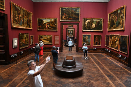 Dresden, Germany- August 30, 2024: Visitors in the Gemaldegalerie Alte Meister (Old Masters Gallery) in Dresden, Germany.のeditorial素材