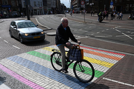 Amsterdam, Netherlands - August 24, 2024: Rainbow crosswalk on the street in the center of Amsterdam.のeditorial素材